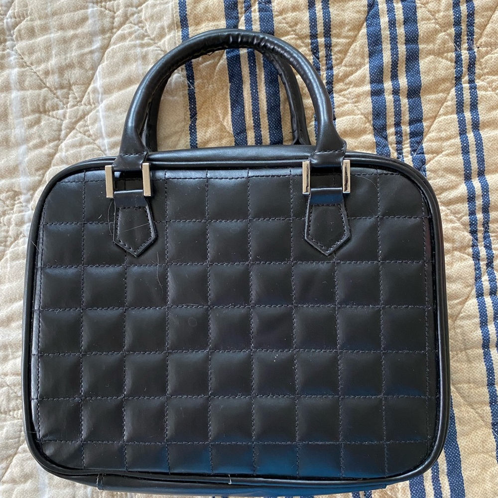 Lori Greiner Silver jewelry keeper bag.